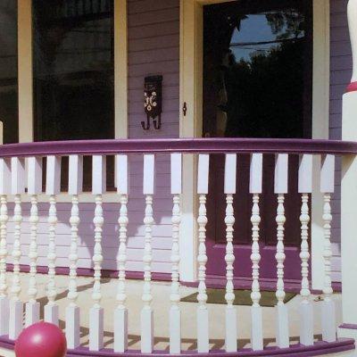 curved railing on porch of Painted Lady   